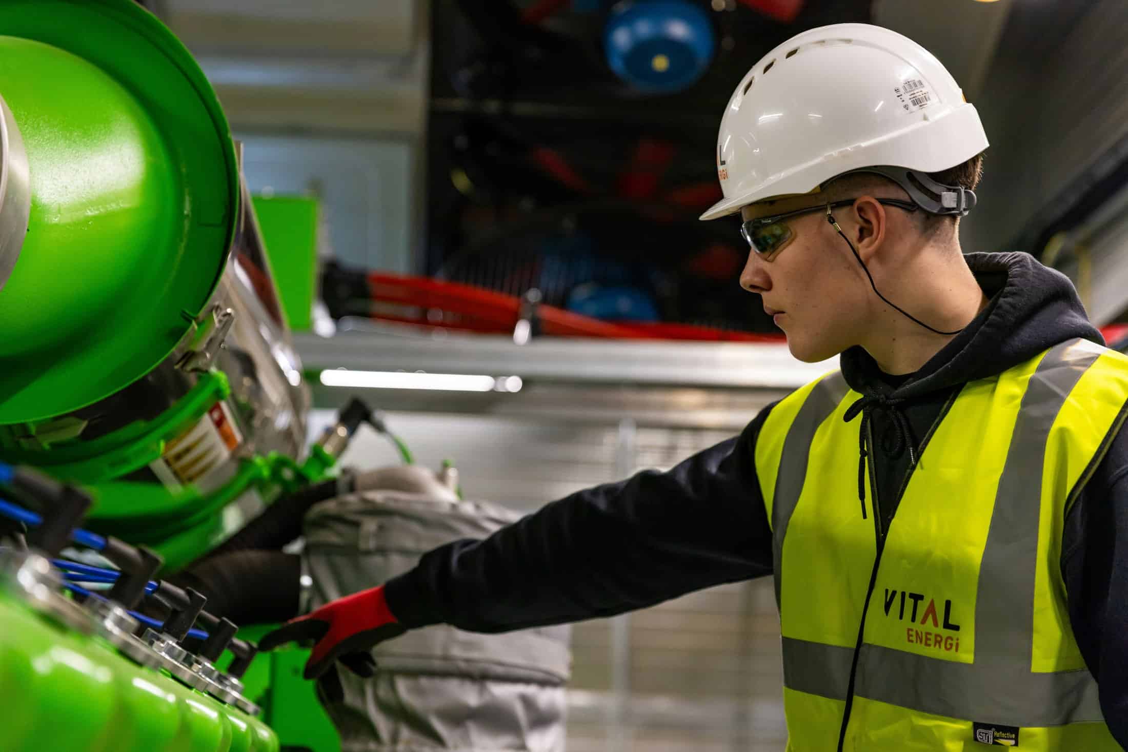 Remake repair or reject threaded connection assessment by a field worker inspecting equipment while wearing PPE.