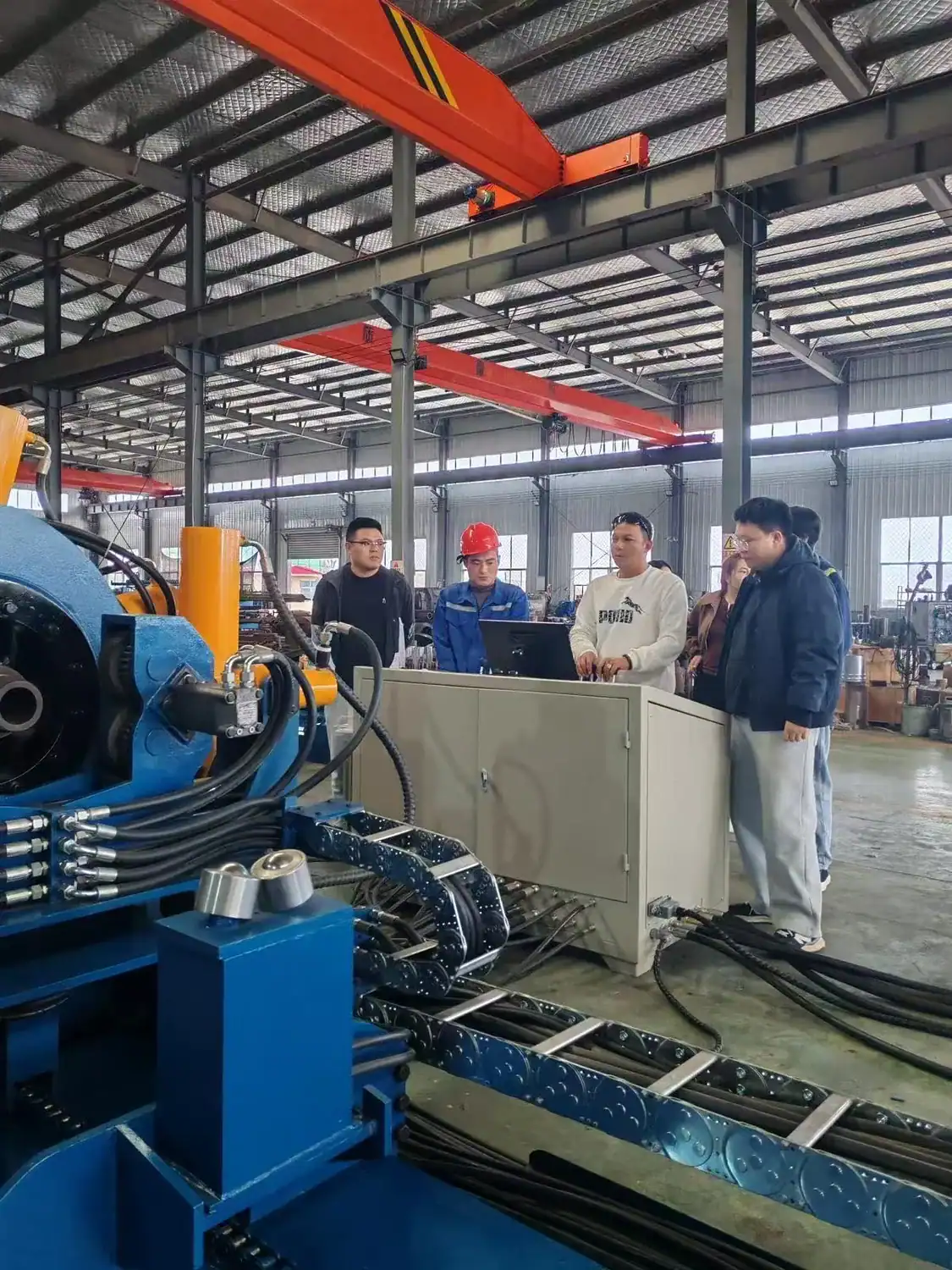 Thailand representatives reviewing a Galip 15-inch breakout unit in the workshop
