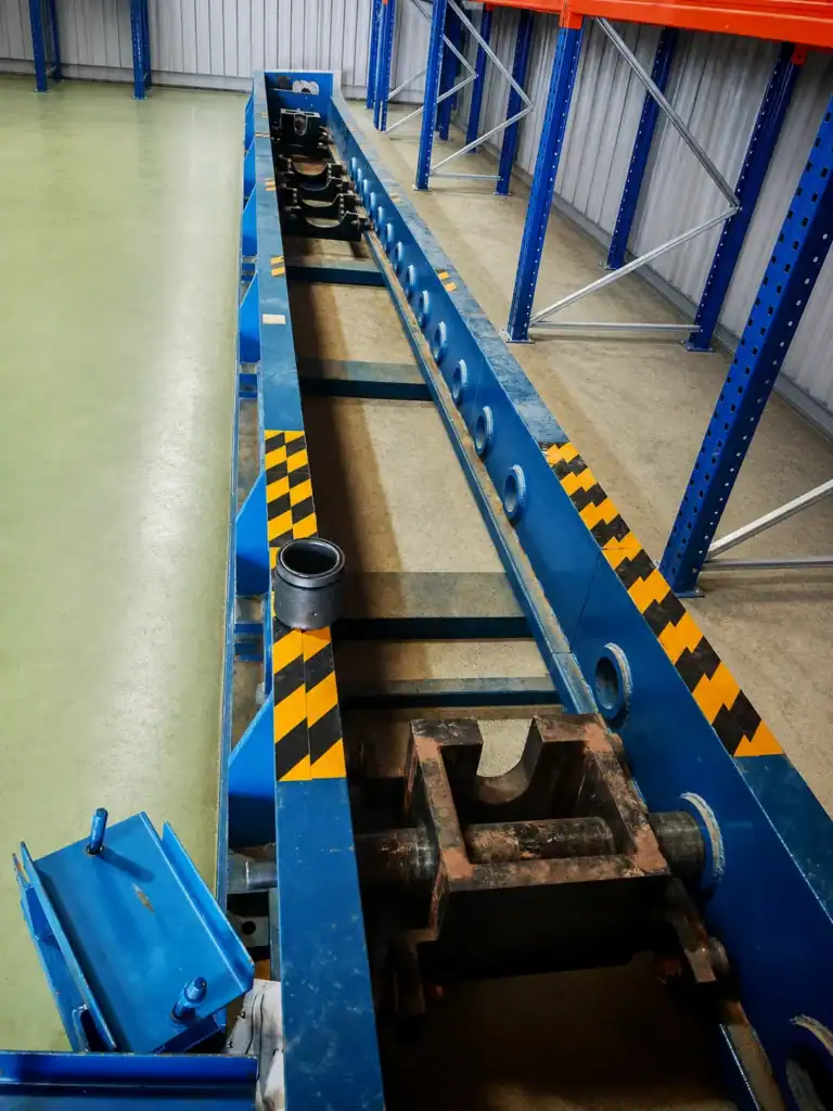Clean workshop view of a Galip drilling jar tester load frame and fixture