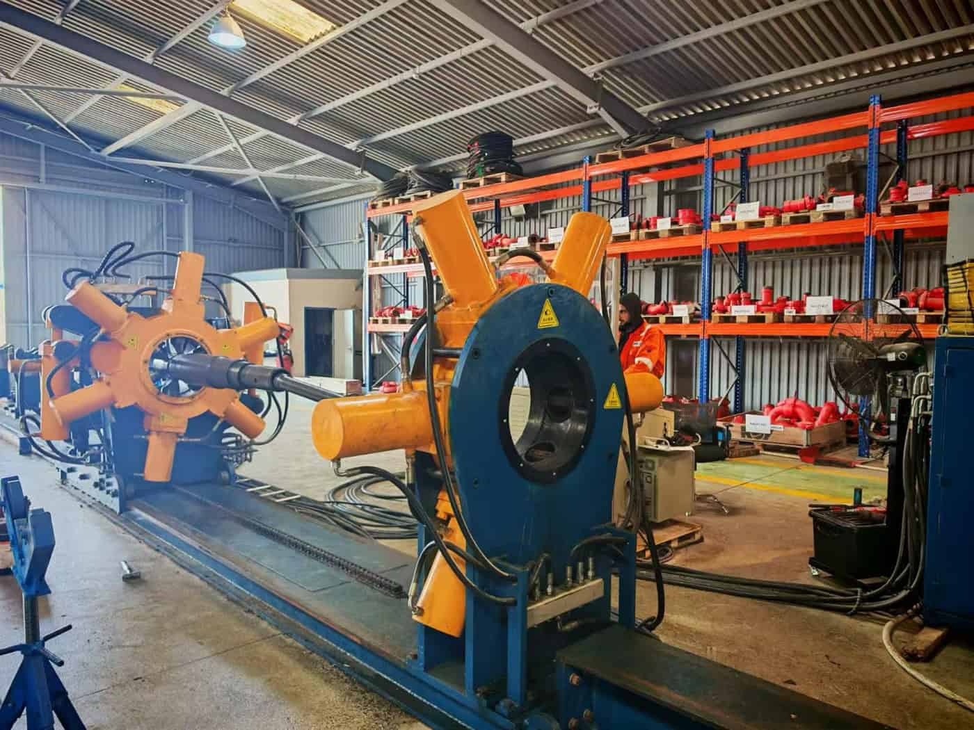 Workover Rig Operations: What Comes Out of the Well, and Where It Goes Next 2 Bucking unit clamp and rotating spindle holding a tubing joint during make-up