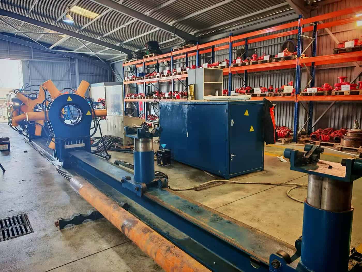 Workover Rig Operations: What Comes Out of the Well, and Where It Goes Next 1 Bucking unit in a workover workshop with production tubing on the loading rail beside it