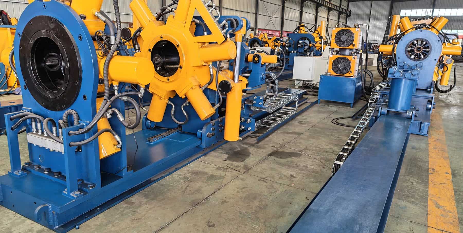 Oilfield drilling equipment with bucking units and motors in factory.